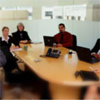 Image depicts staff meeting